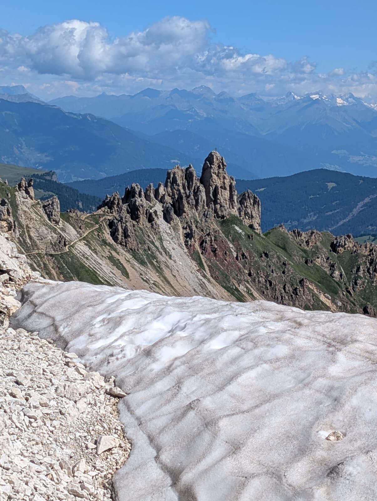 High Dolomites peaks and a remaining summer snowfield