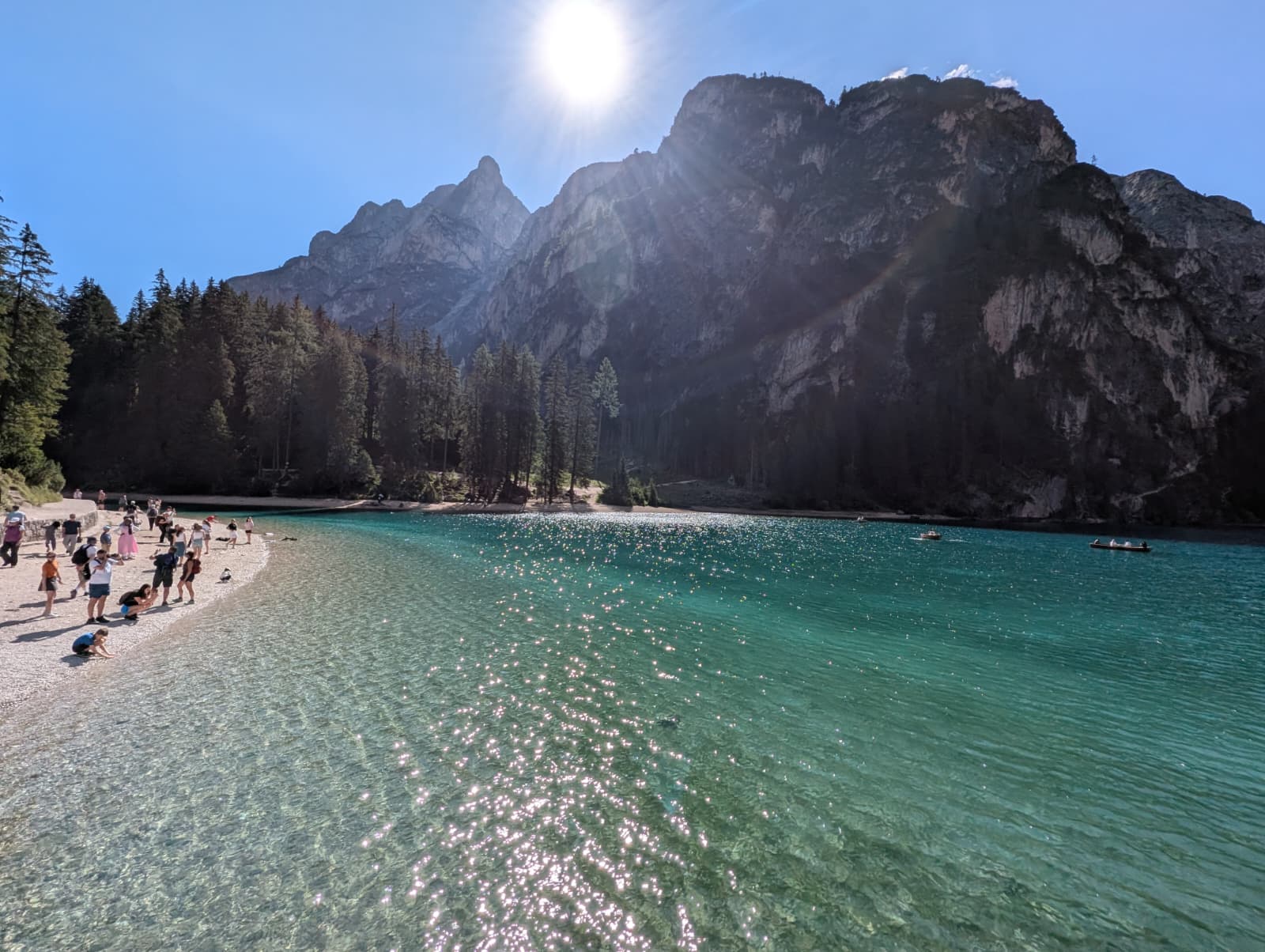 Lago di Braies with clear turquoise water and mountain beach