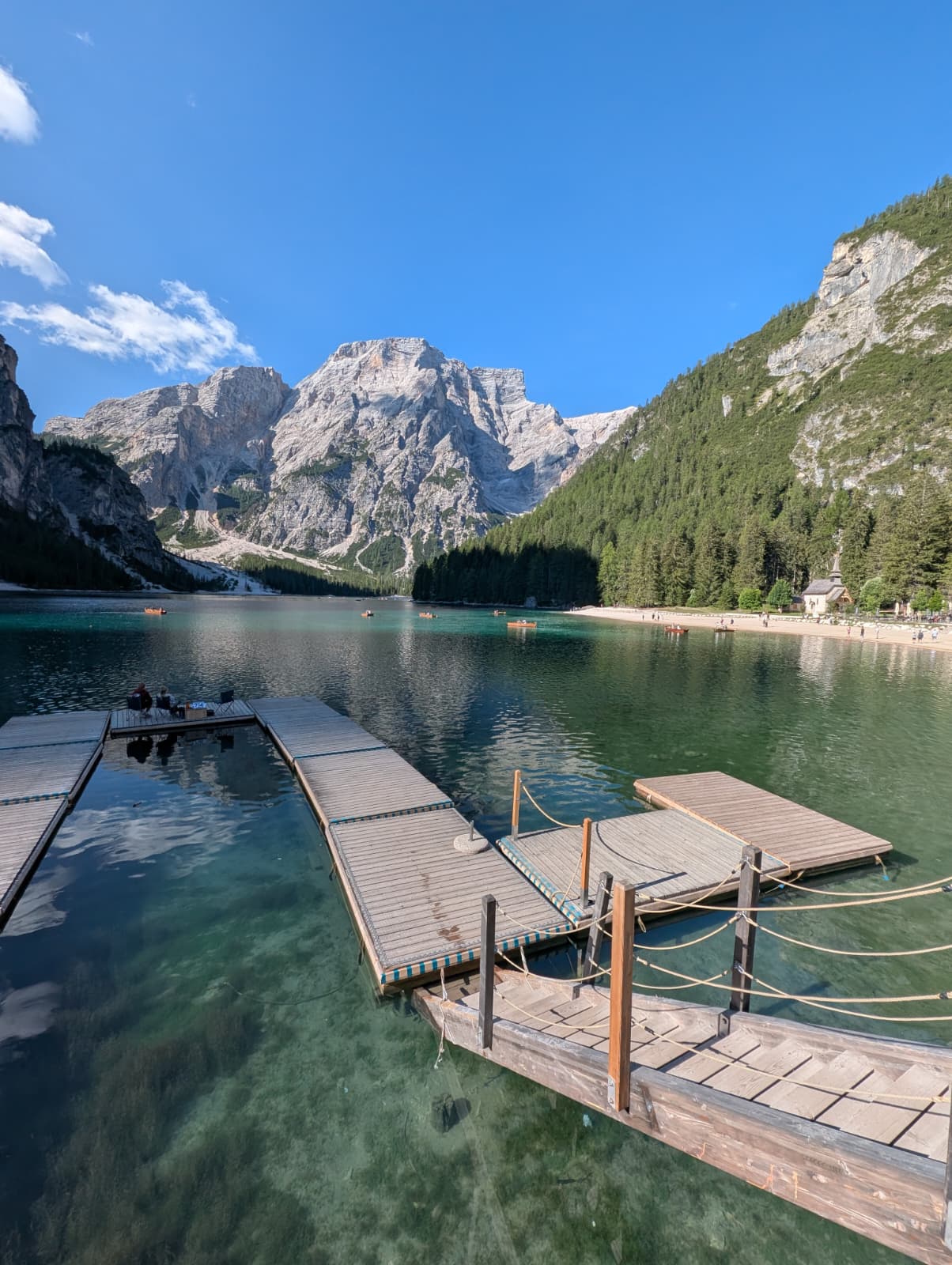 Boat landing on the clear water of Lago di Braies