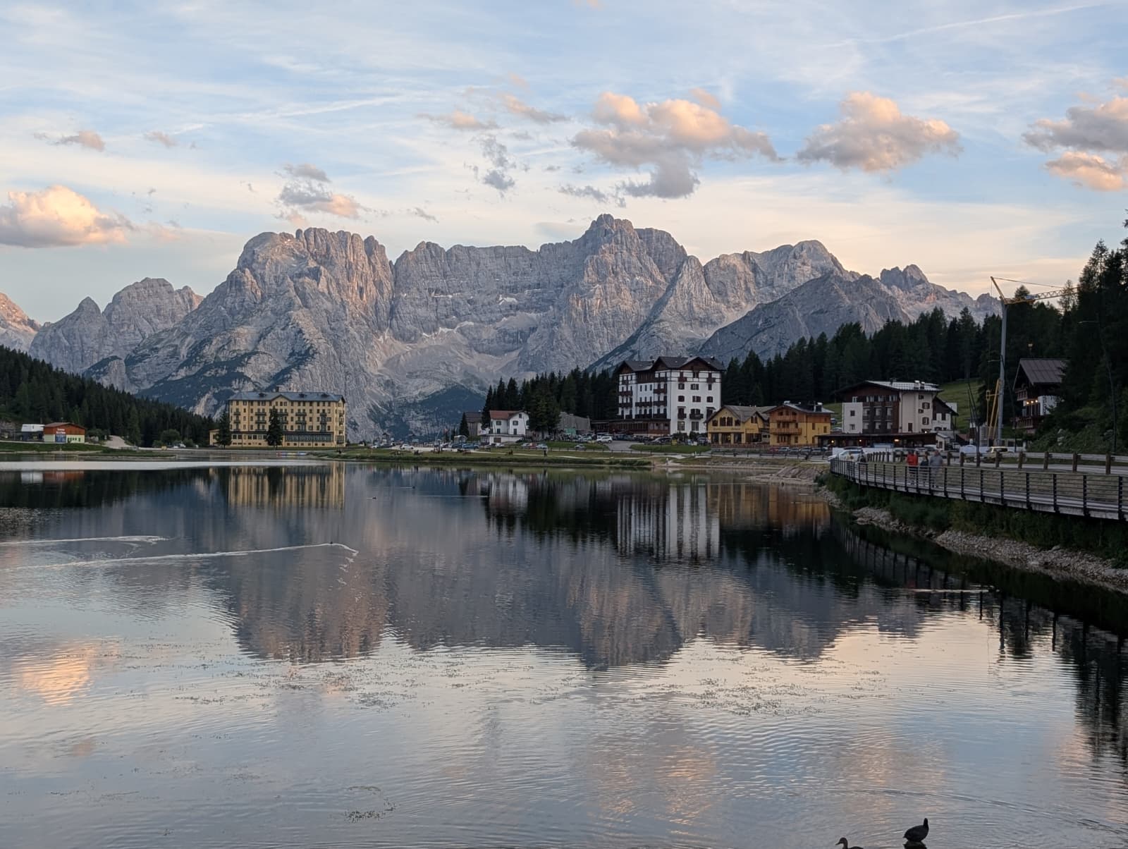 Misurina lake reflecting the evening Dolomites