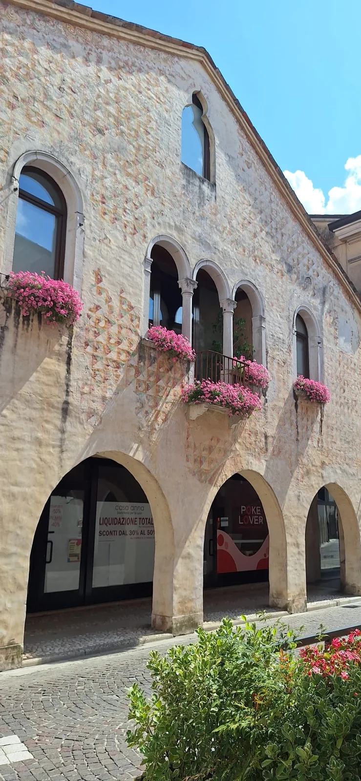 Stone portico decorated with flowers in Oderzo